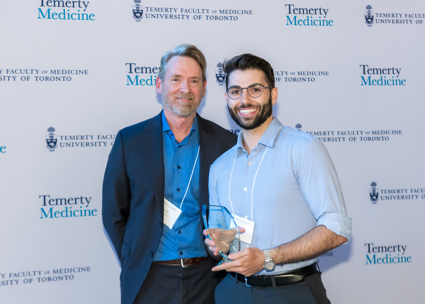 David Hodgson, Vice Chair of Research, presents the J. R. Cunningham Award for Academic Excellence in Research by a Physics Resident to Iymad Mansour.