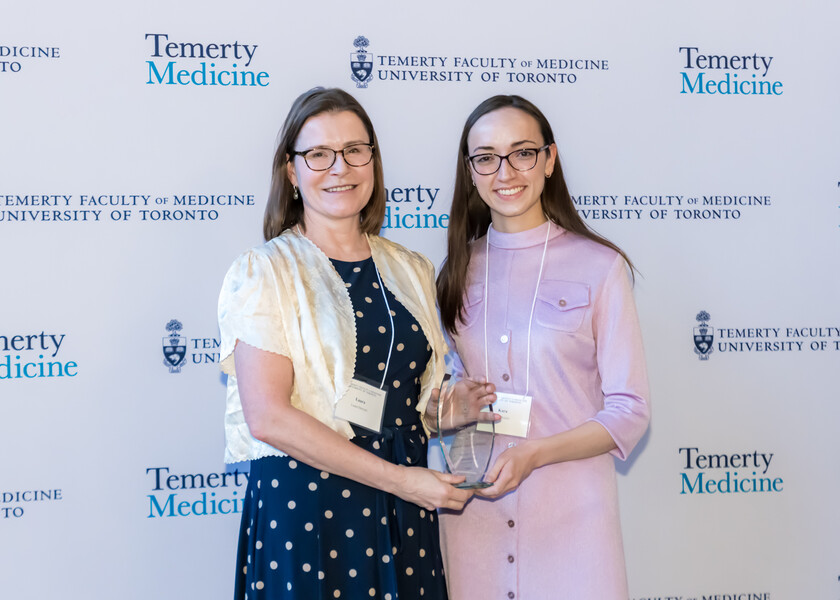 Laura Dawson, Chair, presents the Research Day 2025 Chair’s Award to Kara Ruicci.
