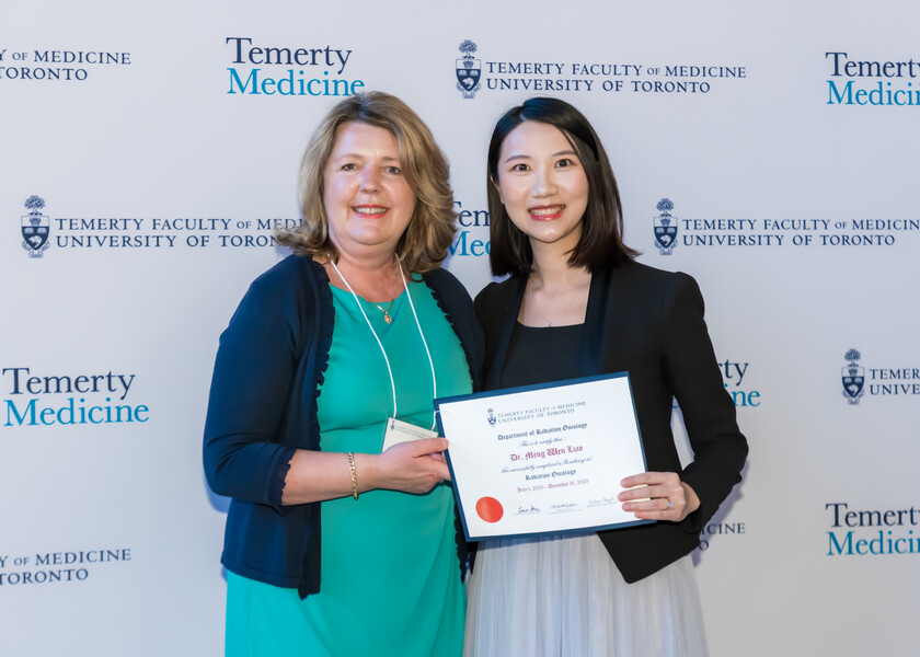 Andrea Bezjak, Director of the Radiation Oncology Residency Program, presents the graduation certificate to Donna Liao.