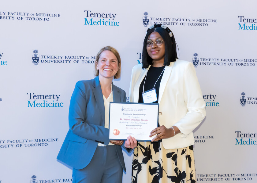 Jennifer Croke, Director of the Radiation Oncology Fellowship Program, presents the graduation certificate to Kehinde Adeyinka.