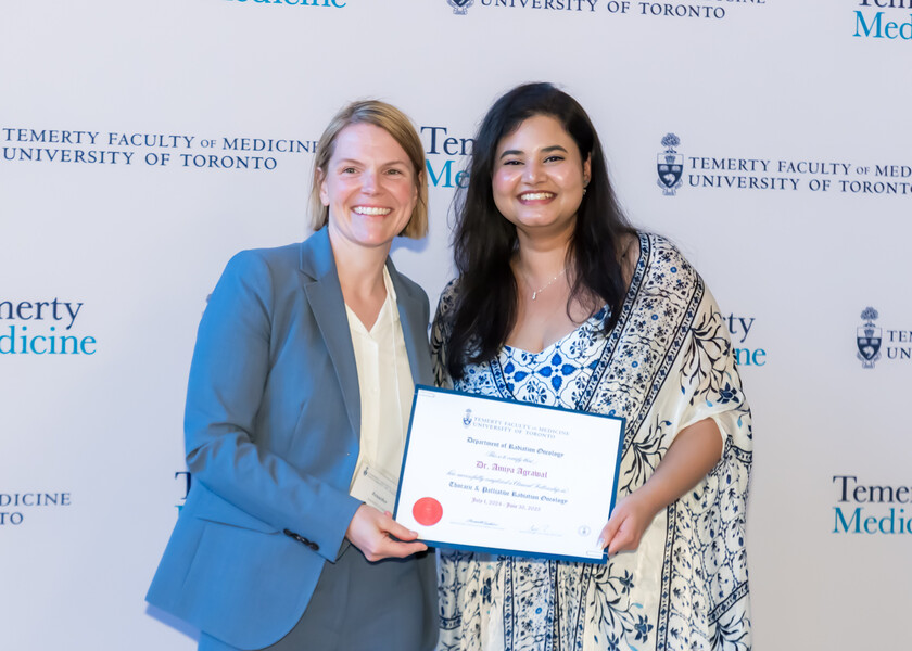 Jennifer Croke, Director of the Radiation Oncology Fellowship Program, presents the graduation certificate to Amiya Agrawal.