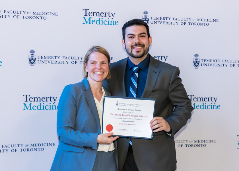Jennifer Croke, Director of the Radiation Oncology Fellowship Program, presents the graduation certificate to Antonio de la Pena.