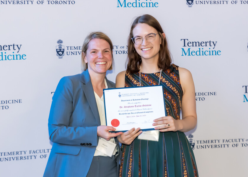 Jennifer Croke, Director of the Radiation Oncology Fellowship Program, presents the graduation certificate to Stephanie Gulstene.