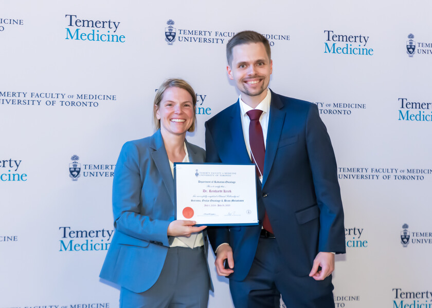 Jennifer Croke, Director of the Radiation Oncology Fellowship Program, presents the graduation certificate to Reinhardt Krcek.