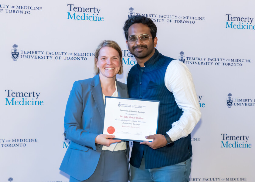 Jennifer Croke, Director of the Radiation Oncology Fellowship Program, presents the graduation certificate to John Mohan Mathew.