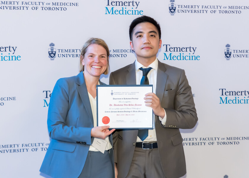 Jennifer Croke, Director of the Radiation Oncology Fellowship Program, presents the graduation certificate to Vito Nicanor.