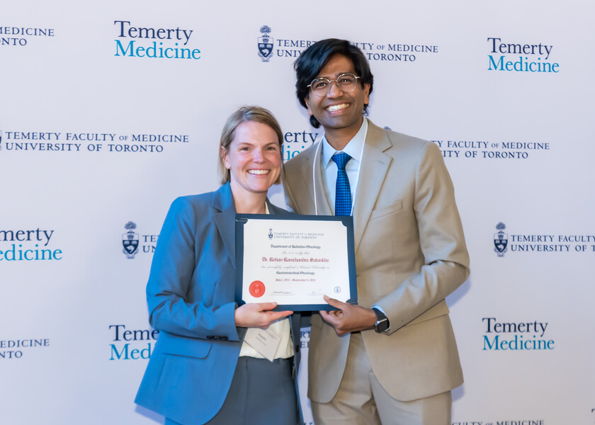 Jennifer Croke, Director of the Radiation Oncology Fellowship Program, presents the graduation certificate to Rohan Salunkhe.