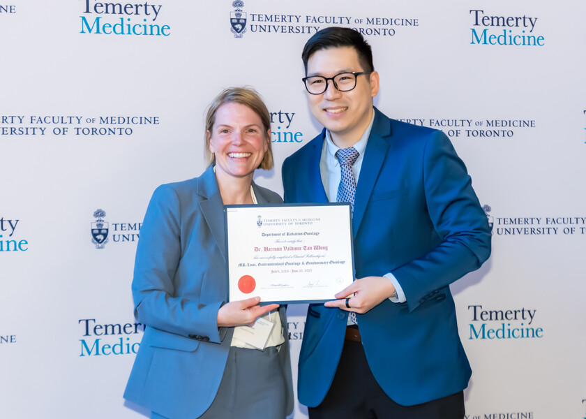 Jennifer Croke, Director of the Radiation Oncology Fellowship Program, presents the graduation certificate to Harroun Wong.