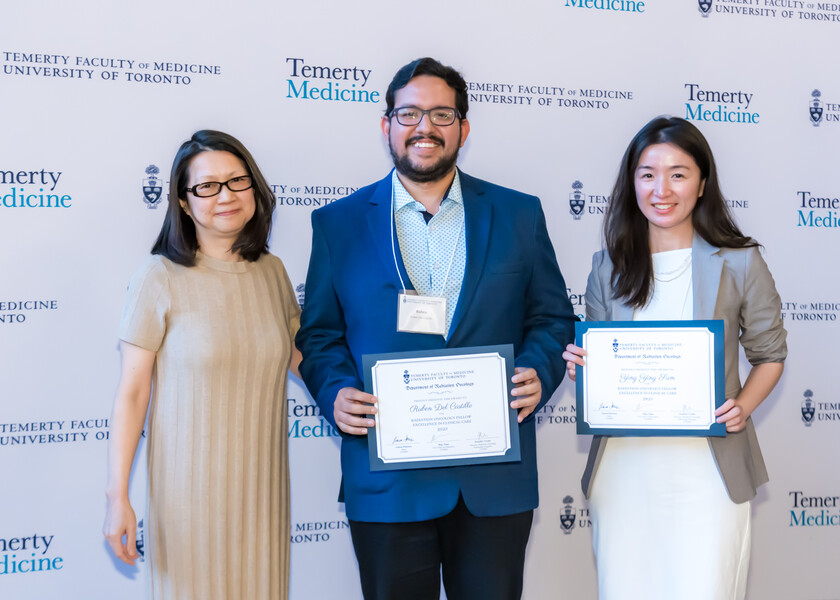May Tsao, UTDRO Vice Chair of Education, presents Radiation Oncology Fellow Excellence in Clinical Care Award to Ruben Del Castillo and Ying Ying Sum.